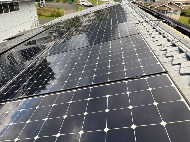 Clean solar panels reflecting the sky like a mirror