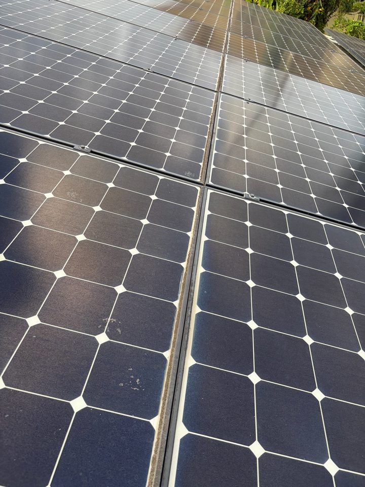 Close up of dirty solar panels with a dull film and spots on the glass